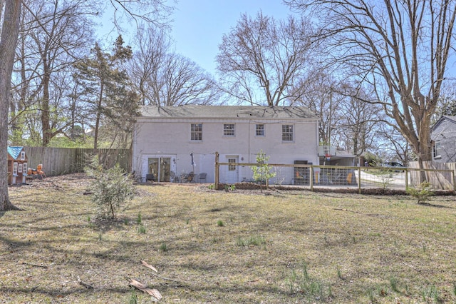 back of property featuring stucco siding and a fenced backyard