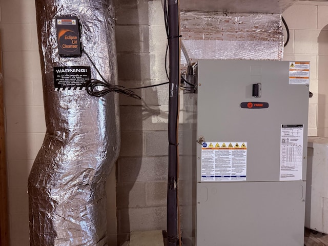 utility room with heating unit