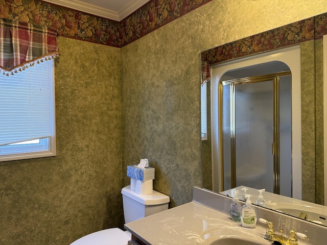 full bath featuring vanity, a shower stall, toilet, and ornamental molding