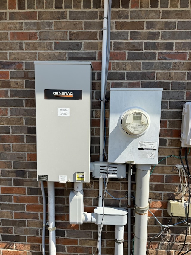 details featuring brick siding and electric meter