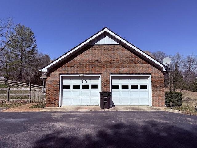 garage featuring fence