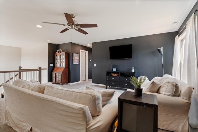 carpeted living area with visible vents, recessed lighting, baseboards, and ceiling fan