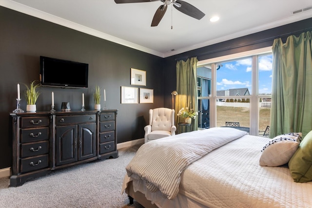 bedroom featuring visible vents, baseboards, ceiling fan, ornamental molding, and light colored carpet