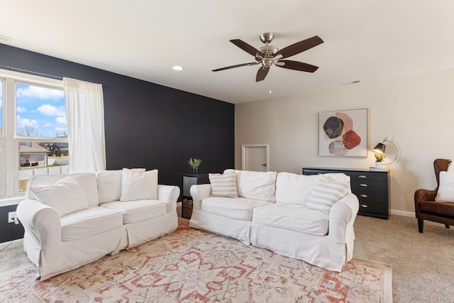 living room featuring a ceiling fan, visible vents, baseboards, carpet floors, and recessed lighting