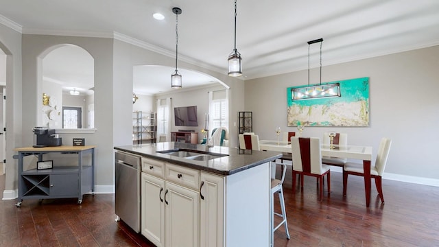 kitchen featuring arched walkways, a sink, dark wood-type flooring, and stainless steel dishwasher