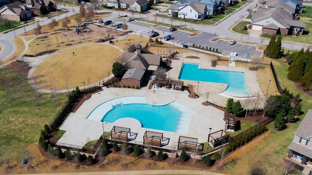 birds eye view of property with a residential view