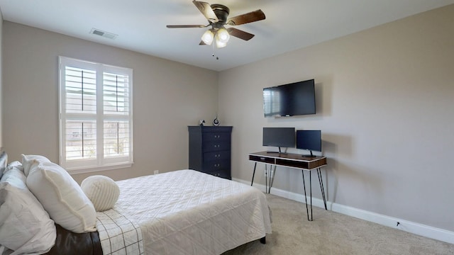 bedroom with baseboards, carpet floors, visible vents, and ceiling fan