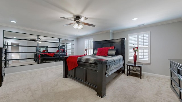 bedroom with crown molding, light colored carpet, visible vents, and baseboards