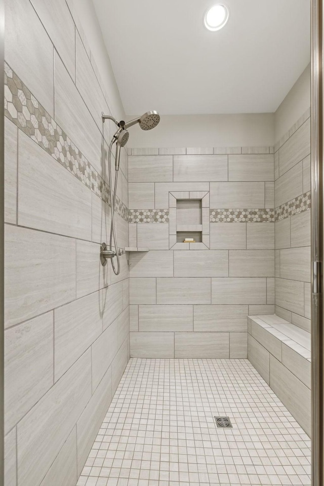 full bath featuring a tile shower