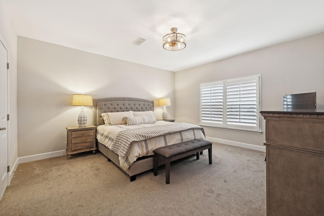 bedroom with carpet, visible vents, and baseboards