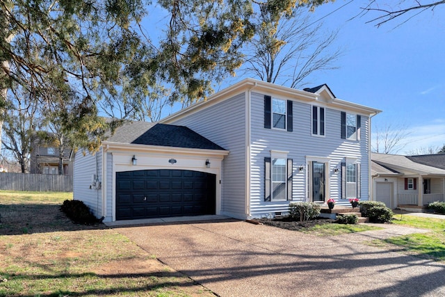 colonial inspired home with driveway, a garage, and fence