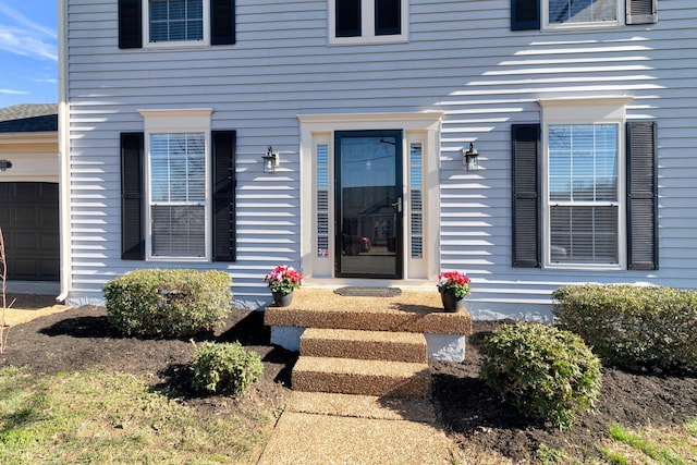 entrance to property featuring a garage