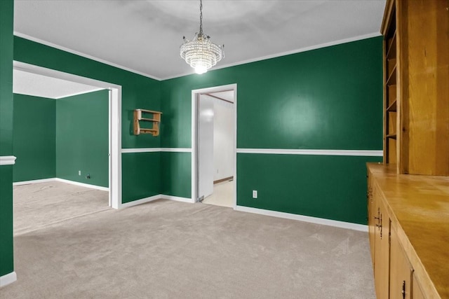 134 N Forrest Ave, Camden, TN 38320 - empty room featuring a chandelier, carpet floors, crown molding, and baseboards