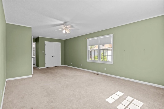 134 N Forrest Ave, Camden, TN 38320 - unfurnished bedroom featuring carpet floors, baseboards, a closet, and ceiling fan