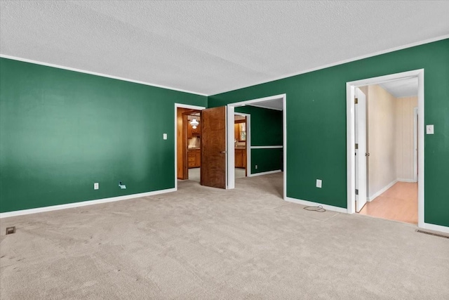 134 N Forrest Ave, Camden, TN 38320 - unfurnished bedroom featuring carpet, a textured ceiling, and baseboards