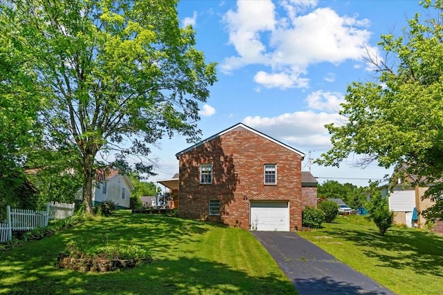 134 N Forrest Ave, Camden, TN 38320 - view of side of home featuring brick siding, a garage, and driveway