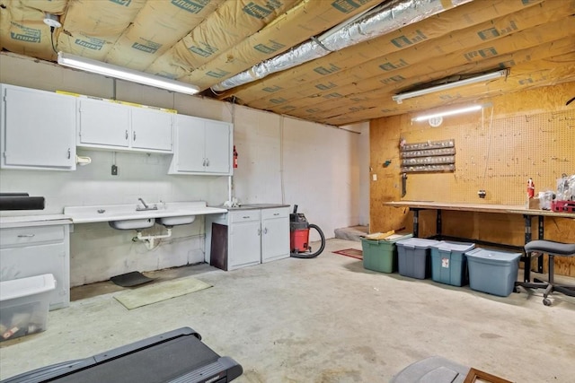 134 N Forrest Ave, Camden, TN 38320 - basement featuring a workshop area and a sink