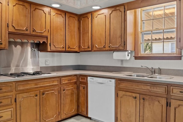 134 N Forrest Ave, Camden, TN 38320 - kitchen featuring dishwasher, a sink, brown cabinets, and electric stovetop