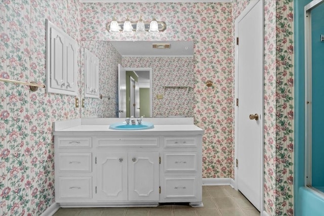 134 N Forrest Ave, Camden, TN 38320 - bathroom with wallpapered walls, vanity, tile patterned floors, and baseboards