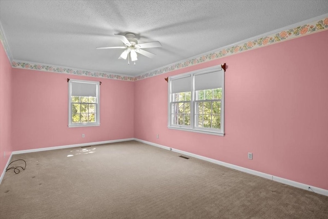 134 N Forrest Ave, Camden, TN 38320 - spare room featuring ceiling fan, a textured ceiling, carpet, and baseboards
