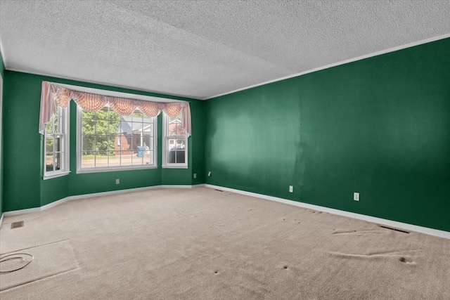 134 N Forrest Ave, Camden, TN 38320 - spare room featuring carpet flooring, a textured ceiling, and baseboards