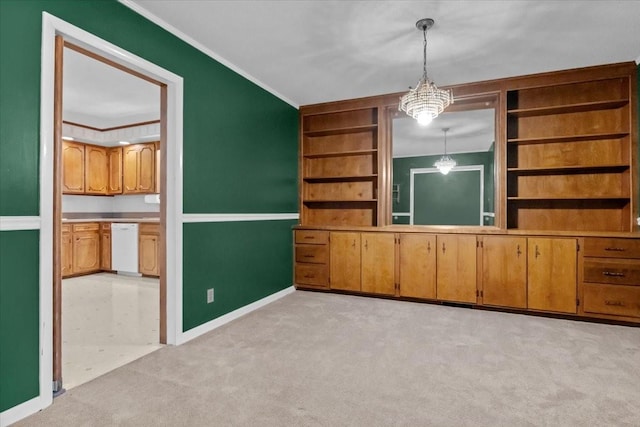 134 N Forrest Ave, Camden, TN 38320 - unfurnished dining area with light colored carpet, crown molding, built in features, baseboards, and a chandelier