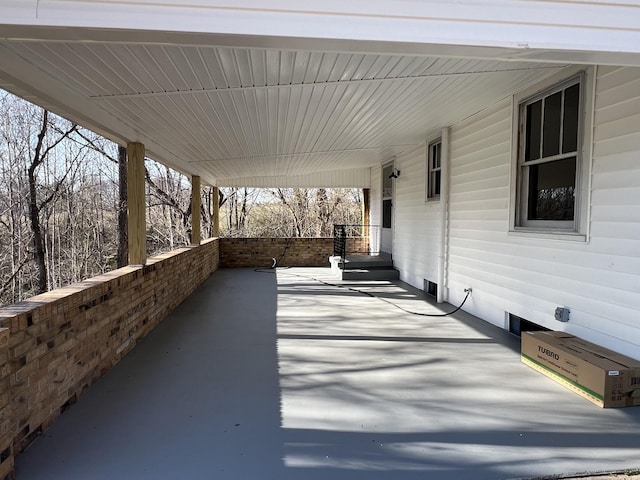 view of patio featuring an attached carport and covered porch