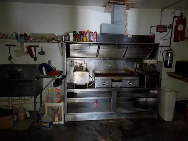 interior space featuring concrete floors and a sink