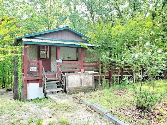 view of front of home featuring board and batten siding and covered porch
