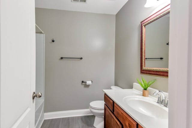 full bath featuring visible vents, walk in shower, baseboards, toilet, and vanity