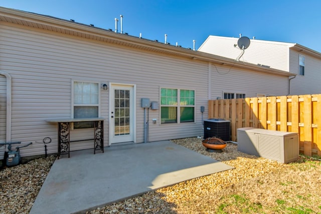 back of property featuring a patio, cooling unit, and fence