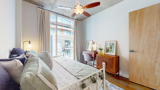 bedroom with concrete floors and ceiling fan