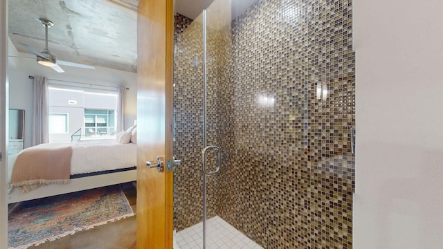 bathroom with a ceiling fan, a stall shower, and ensuite bathroom