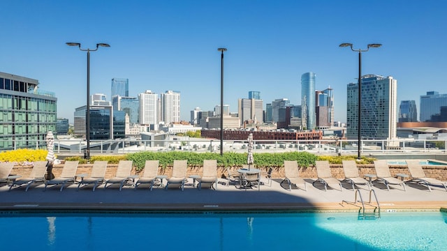 view of swimming pool with a city view