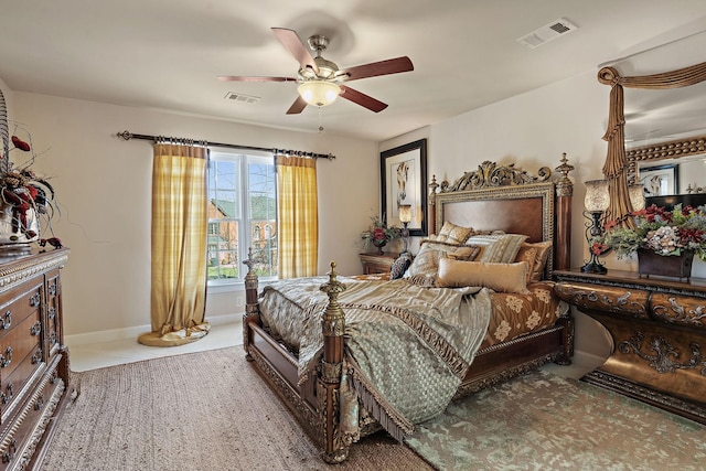 bedroom featuring a ceiling fan, visible vents, and baseboards