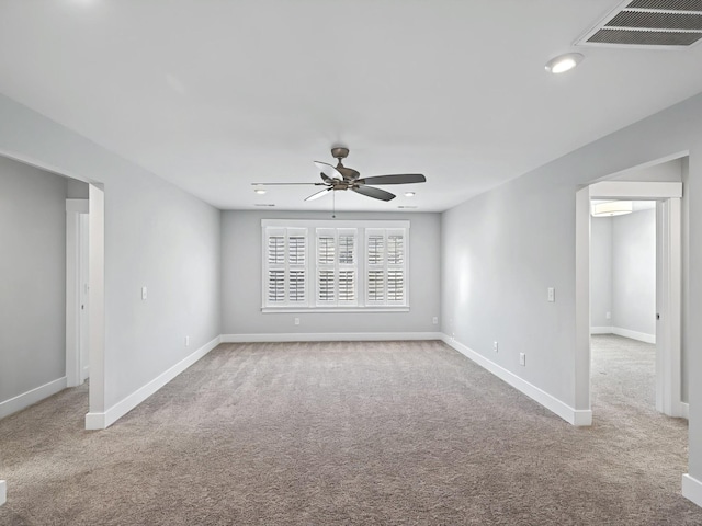 carpeted empty room featuring recessed lighting, baseboards, visible vents, and ceiling fan