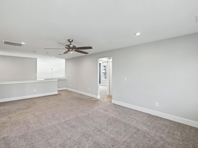 unfurnished room featuring visible vents, baseboards, ceiling fan, light colored carpet, and recessed lighting