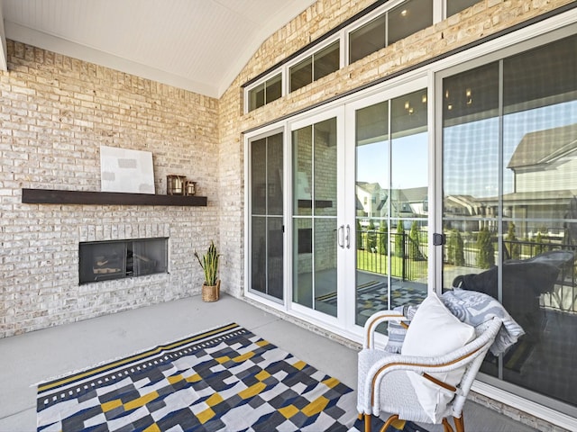 view of patio / terrace with an outdoor brick fireplace