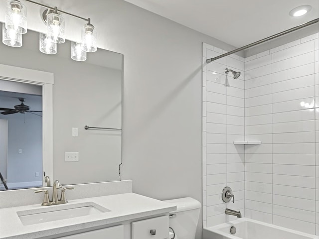 bathroom featuring toilet, vanity, a ceiling fan, and washtub / shower combination