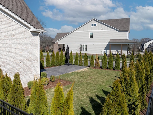 view of yard with a patio and fence