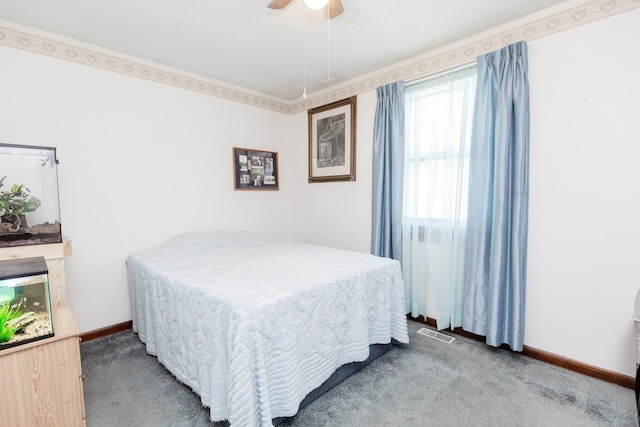 bedroom with visible vents, baseboards, carpet, and ceiling fan