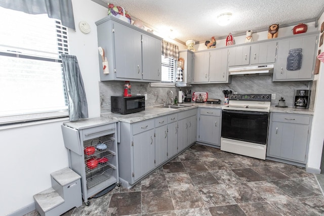 kitchen featuring white range with electric cooktop, gray cabinets, a sink, black microwave, and under cabinet range hood