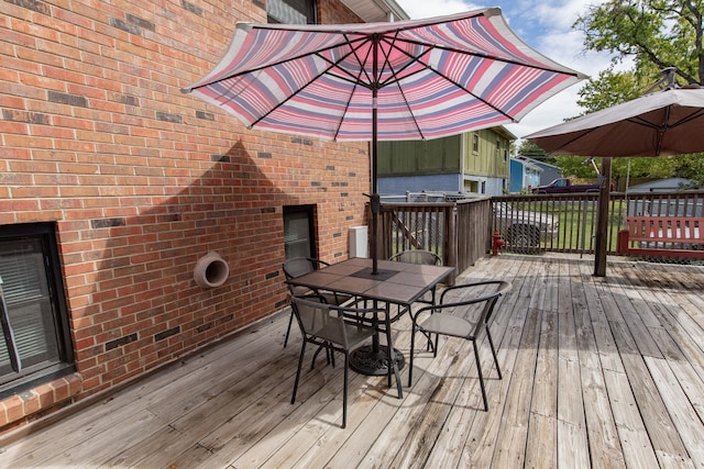 deck with outdoor dining area