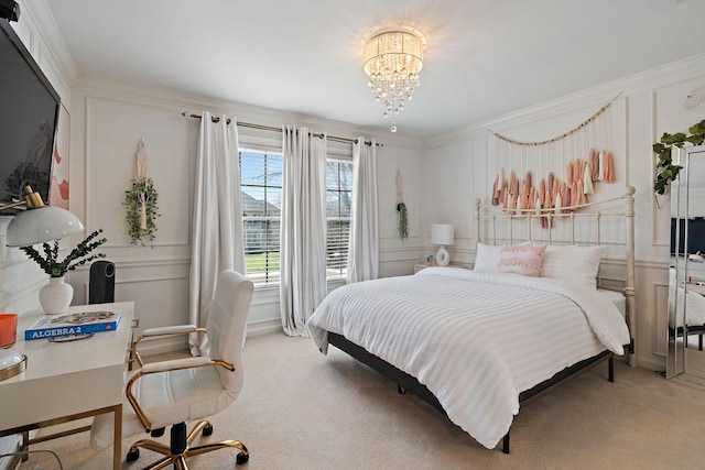 bedroom with a notable chandelier, a decorative wall, light colored carpet, and crown molding