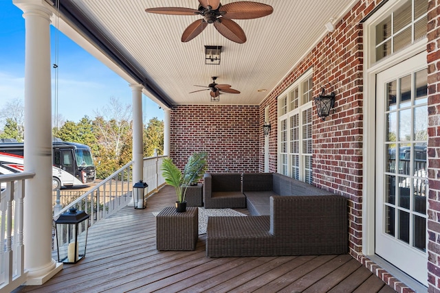 deck with a ceiling fan and an outdoor hangout area