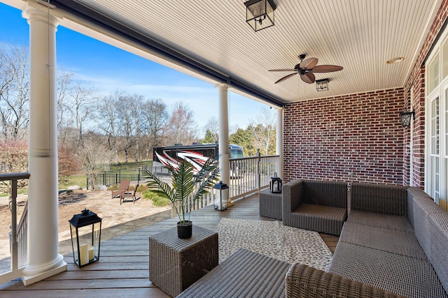 view of patio / terrace with an outdoor living space and ceiling fan