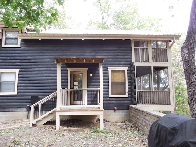 exterior space with faux log siding