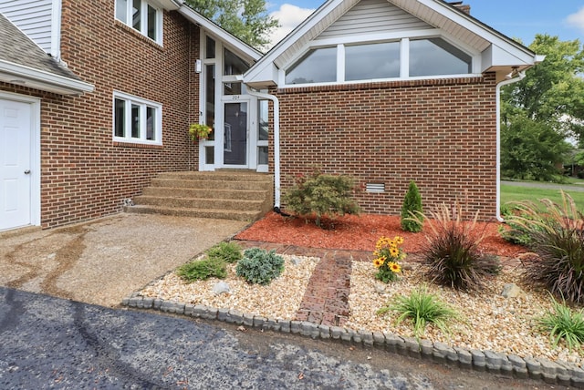 view of front of house with brick siding