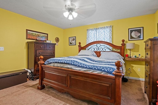 bedroom featuring carpet flooring, a ceiling fan, baseboards, and a textured ceiling