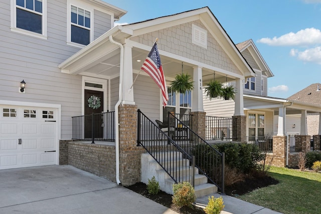 view of front of home with a porch and concrete driveway